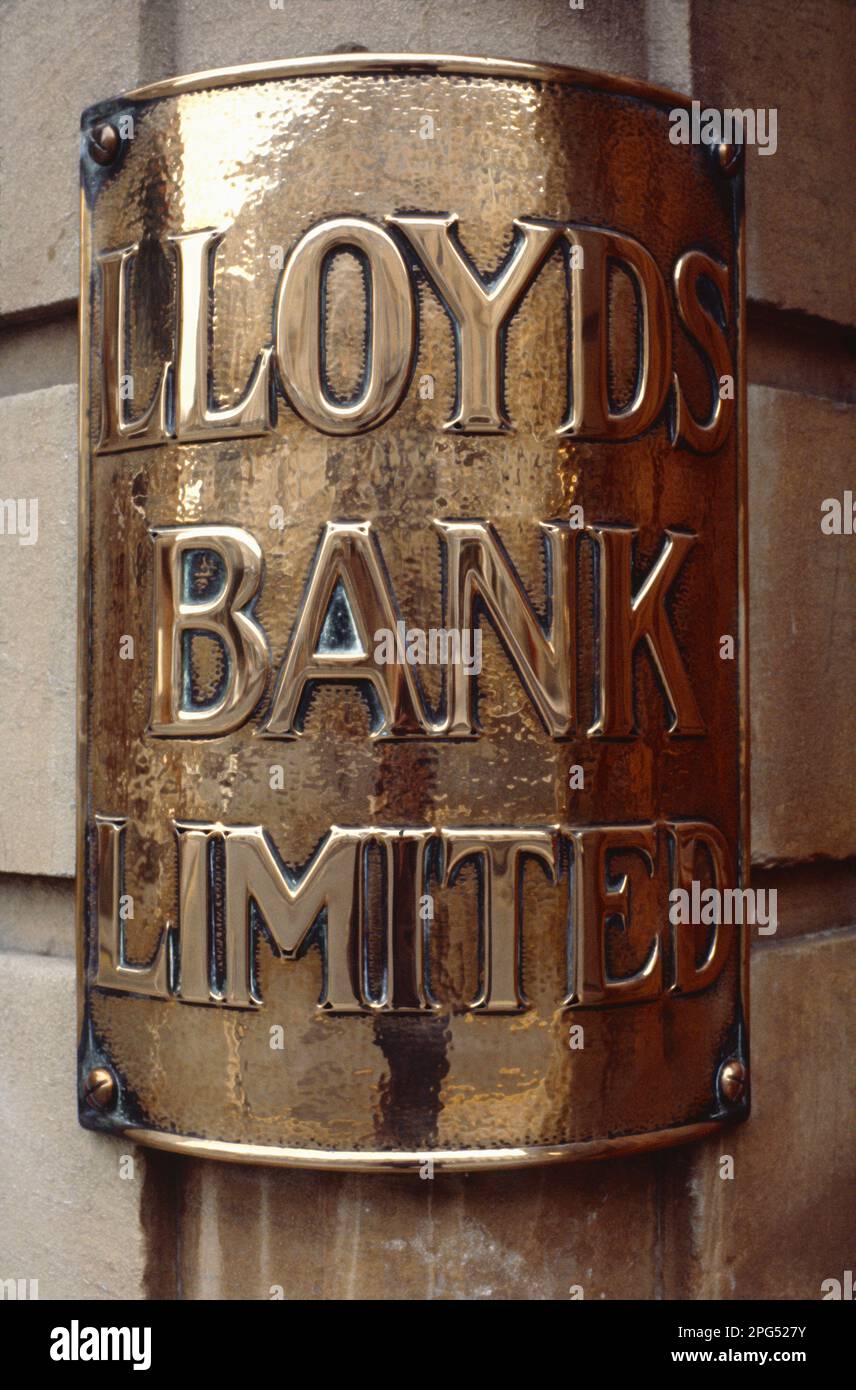 United Kingdom. England. Somerset. Bath. Lloyds Bank. Historic curved brass name plate. Stock Photo