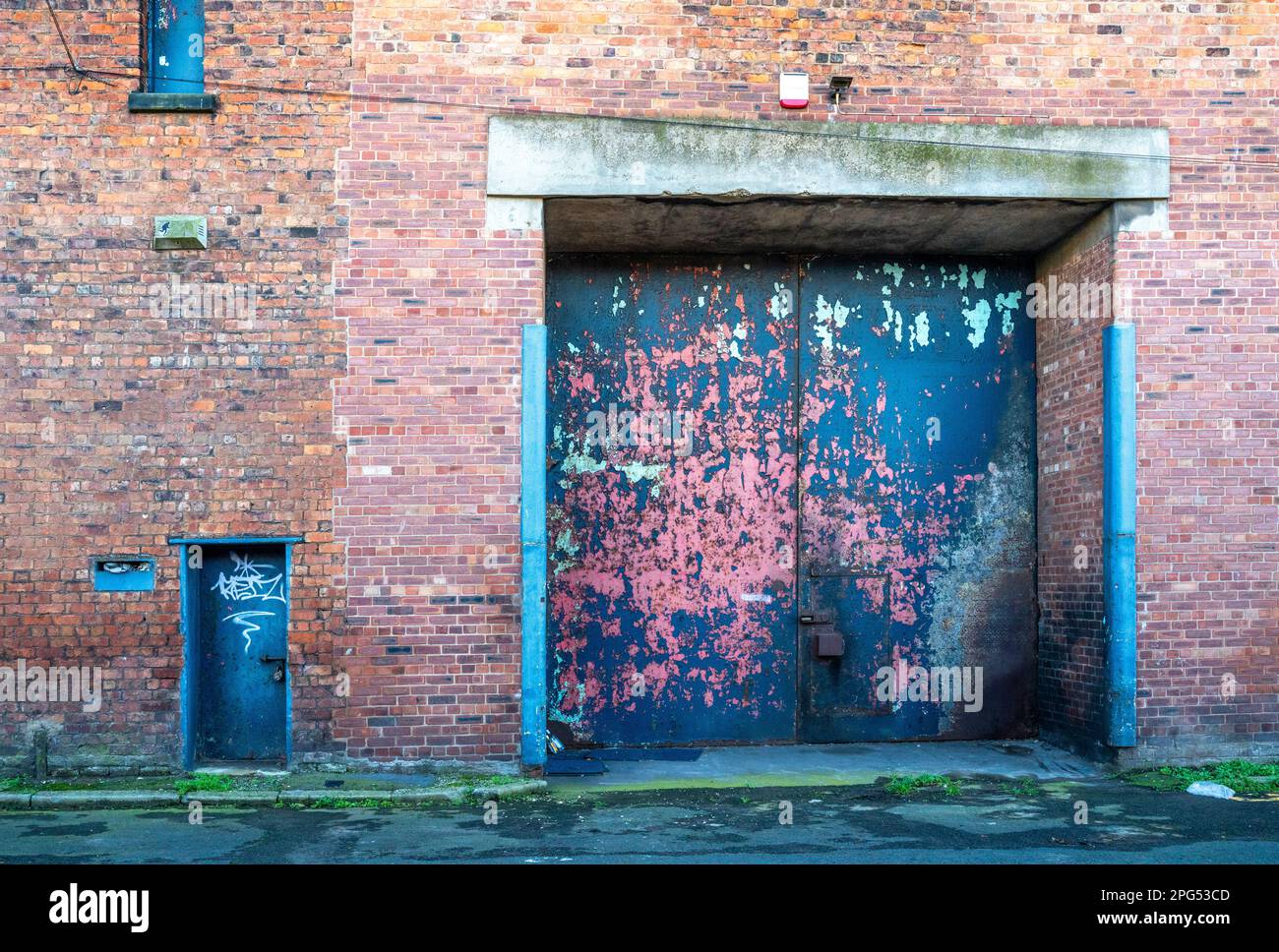 Steel loading bay doors in Liverpool warehouse Stock Photo