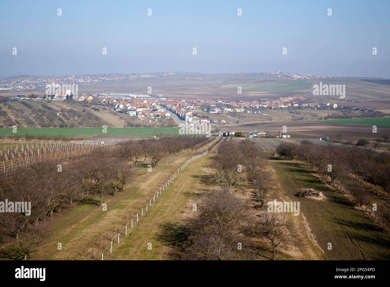 A rural landscape featuring a farm and buildings in the distance, Velke Pavlovice, czech republic Stock Photo