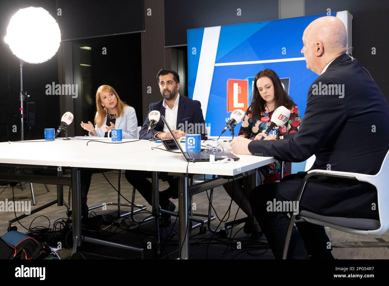 LBC presenter, Iain Dale (far right) with (left to right) SNP leadership candidates, Ash Regan, Humza Yousaf and Kate Forbes, during a SNP leadership hustings hosted by LBC at their studios in Glasgow. Picture date: Monday March 20, 2023. Stock Photo