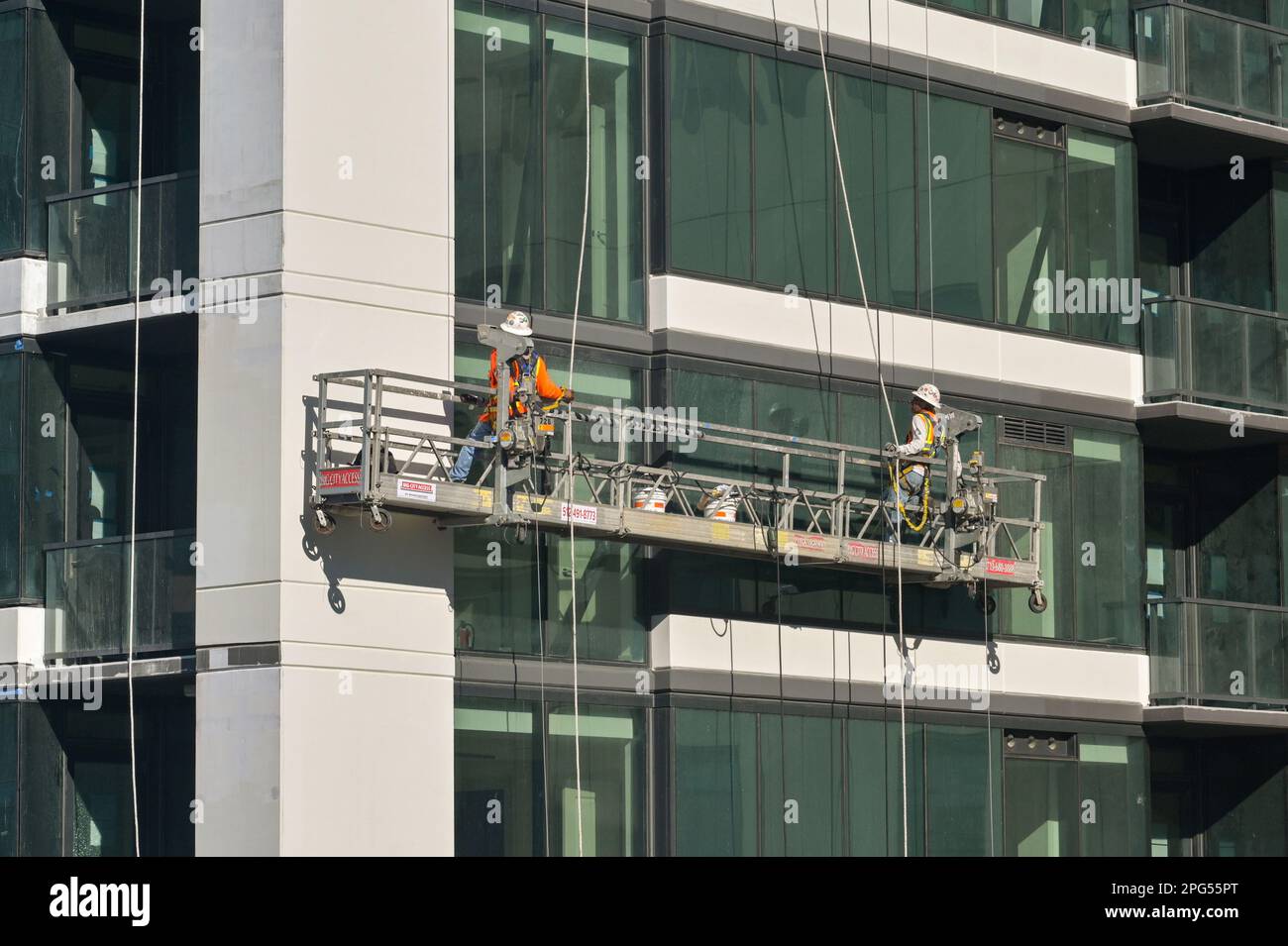 Austin, Texas, USA February 2023 Window cleaners on a cradle