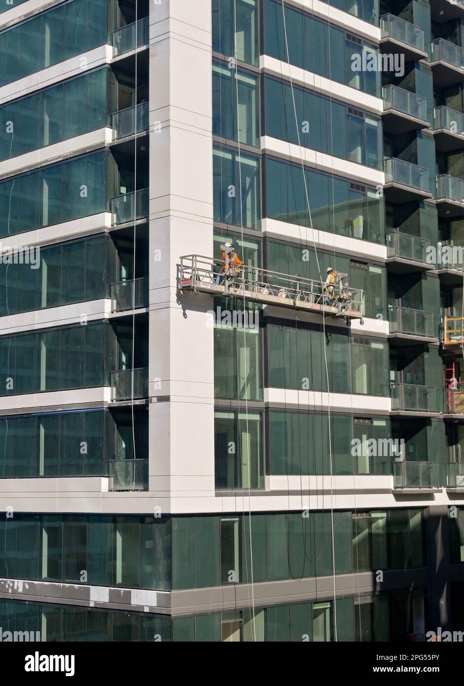 Austin, Texas, USA February 2023 Window cleaners on a cradle