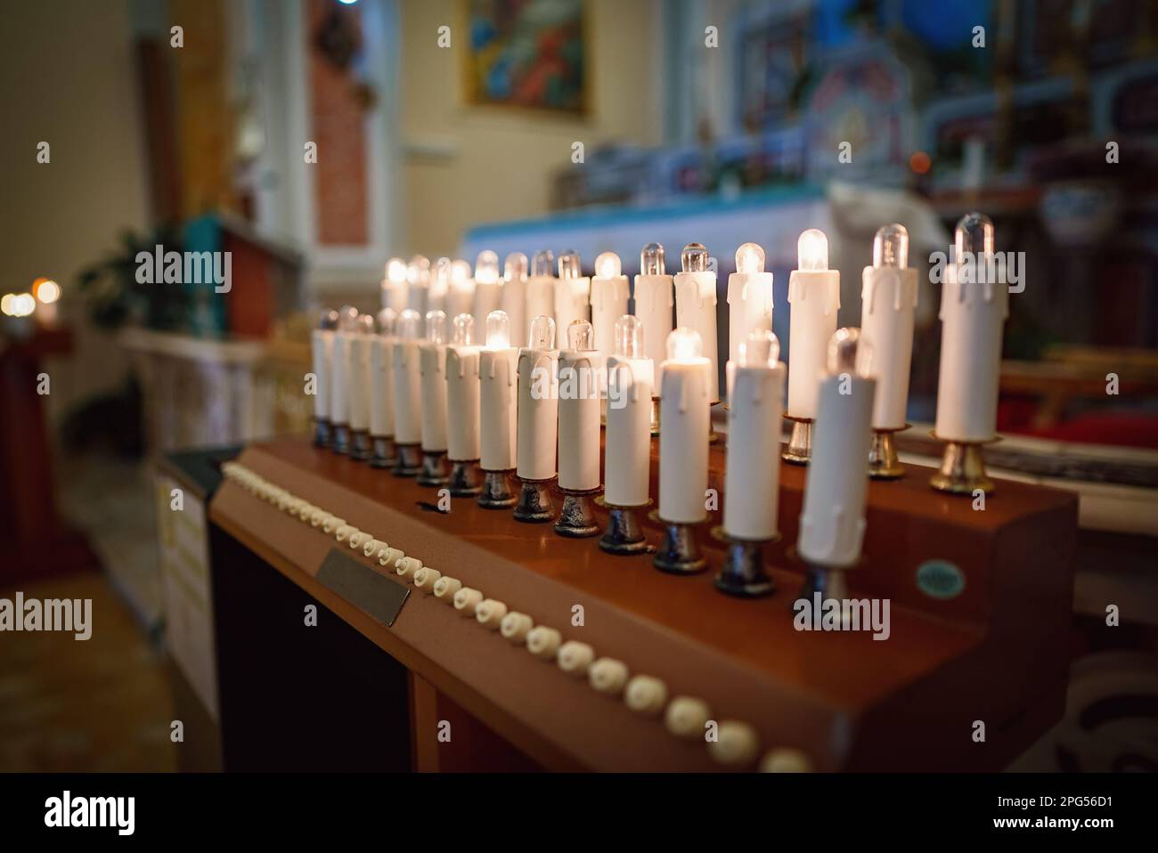 Modern electronic candles in the church Stock Photo Alamy