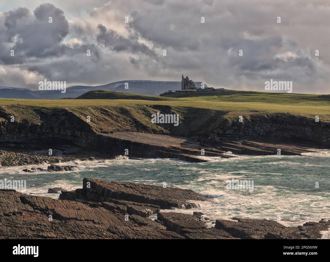 Distant view of Classiebawn castle at the coast of Mullaghmore Head, County Sligo, Ireland Stock Photo