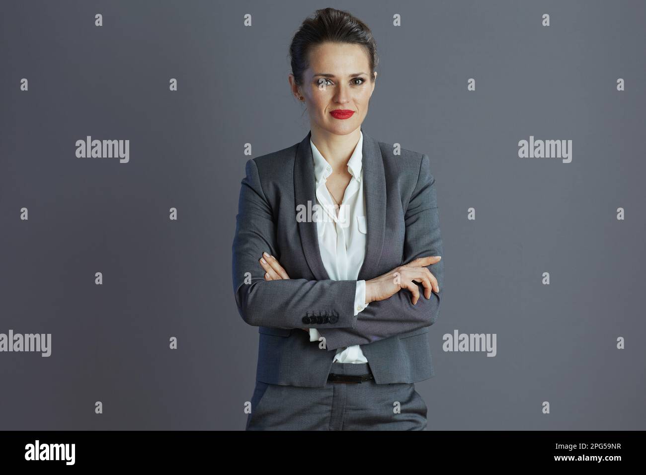 Professional woman in gray suit hi-res stock photography and images - Alamy