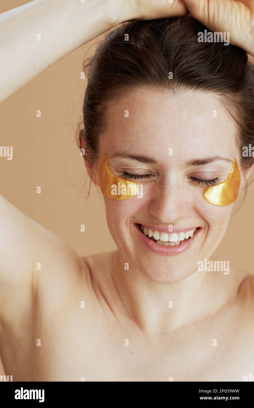 smiling modern woman with eye patches Stock Photo Alamy