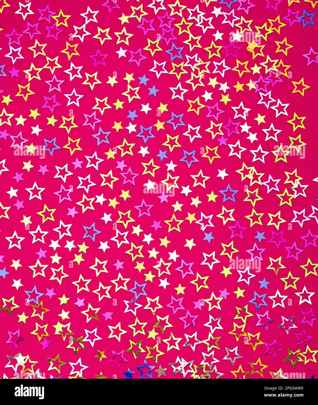 Star background - Colorful party confetti with sparkling stars. Rhodamine red color in foamy Stock Photo
