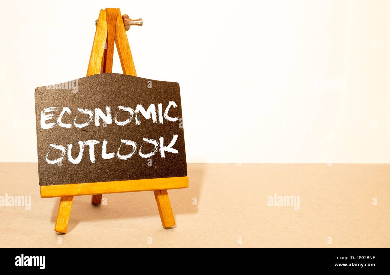 economic outlook - text word on the paper. Stock Photo