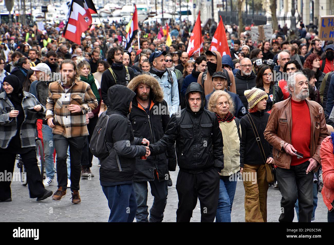 Marseille, France. 18th Mar, 2023. Protesters march through the streets of Marseille during the demonstration. People took part in a demonstration, unauthorized by the prefecture, to protest against the pension reform wanted by the French government which would raise the retirement age from 62 to 64. (Photo by Gerard Bottino/SOPA Images/Sipa USA) Credit: Sipa USA/Alamy Live News Stock Photo
