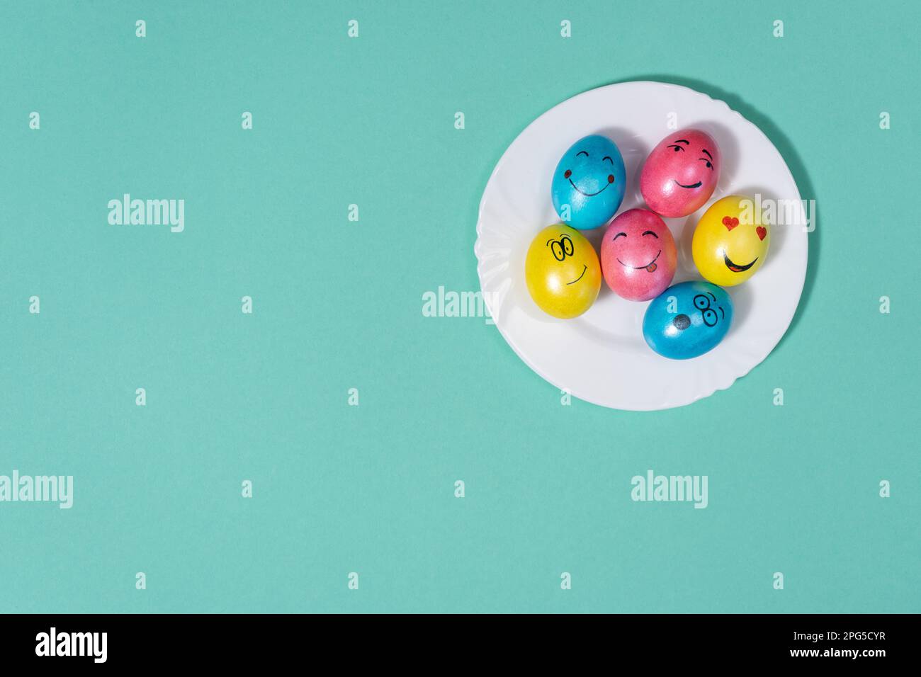 cute easter eggs with funny faces, top view Stock Photo