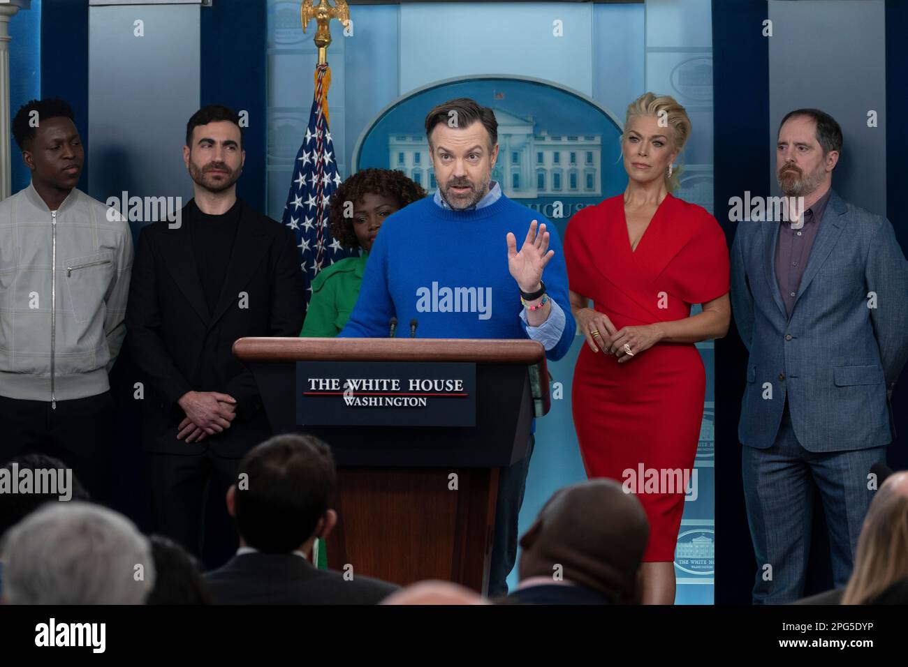 Washington, DC. 20th Mar, 2023. Actor Jason Sudeikis, standing with other members of the cast the of the series Ted Lasso speaks to the media in the briefing room at the White House in Washington, DC, on March 20, 2023. The cast were at the White House to meet with United States President Joe Biden and first lady Dr. Jill Biden about the importance of addressing mental health issues. Pictured from left, Toheeb Jimoh, Brett Goldstein, Karine Jean-Pierre, Jason Sudeikis, Hannah Waddingham, and Brendan Hunt. Credit: Chris Kleponis/CN/dpa/Alamy Live News Stock Photo