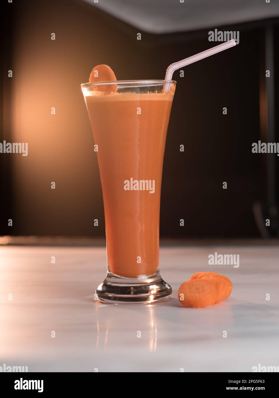 Carrot Juice glass photo served in restaurant from a low angle Stock