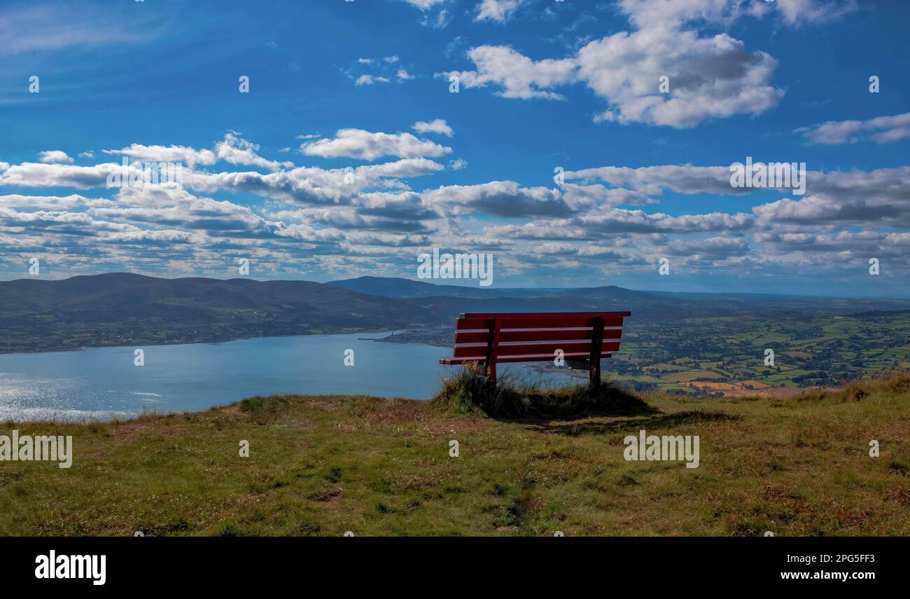 Bench at the top of Slieve Martin in Northern Ireland, looking across to the Ring of Gullion in the distance and the Cooley Mountains in Ireland Stock Photo