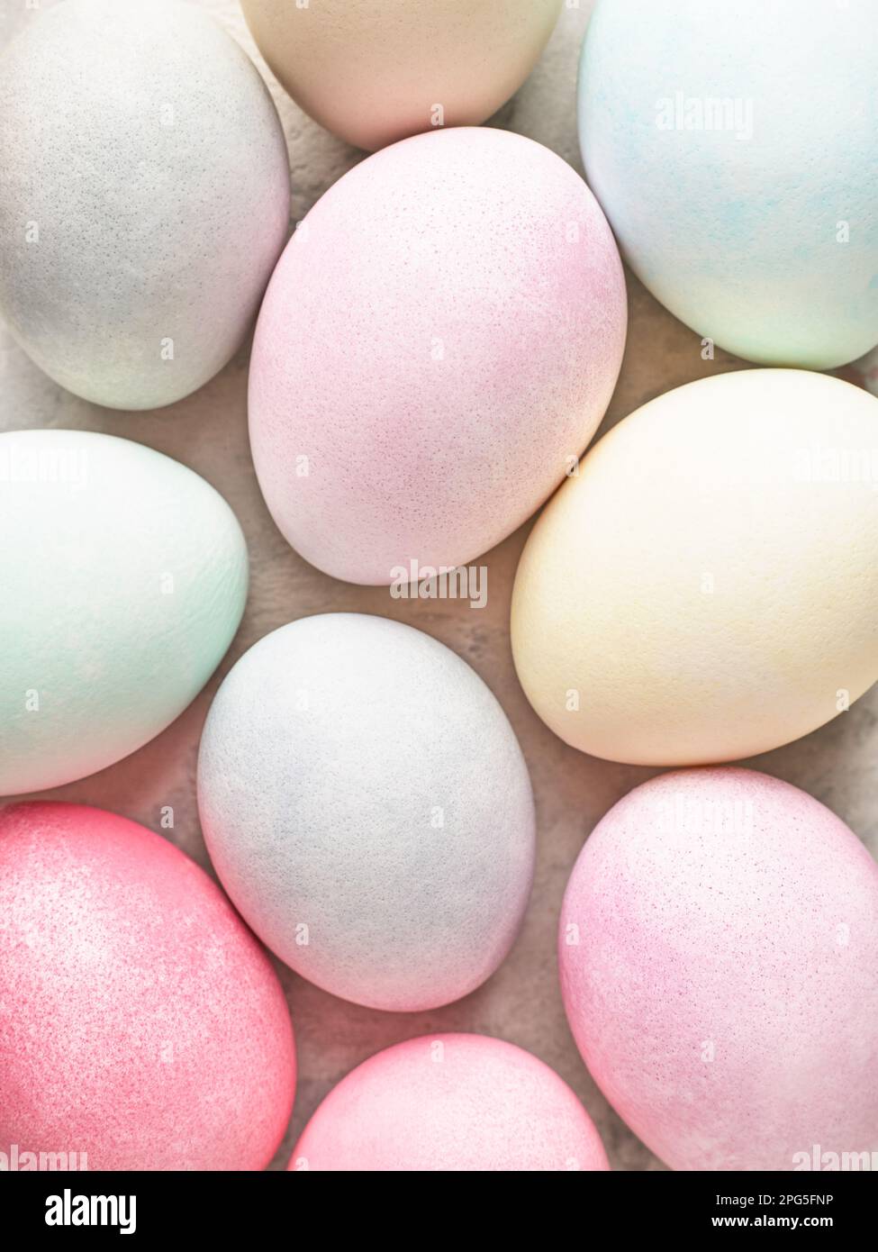 Easter background, colorful pastel dyed Easter eggs close up. Stock Photo