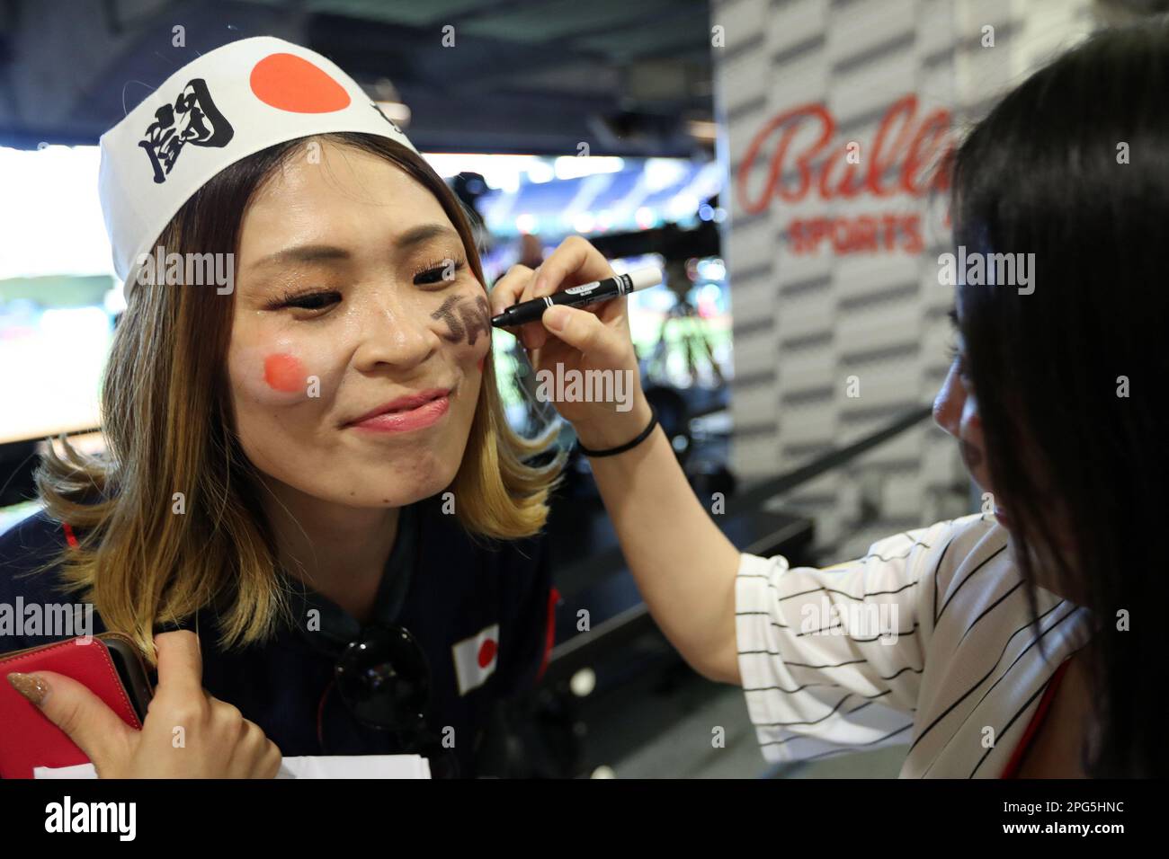 Miami, United States. 20th Mar, 2023. A Japanese baseball fan has her face painted prior to the 2023 World Baseball Classic semifinal game between Japan and Mexico in Miami, Florida on Monday, March 20, 2023. Photo by Aaron Josefczyk/UPI Credit: UPI/Alamy Live News Stock Photo