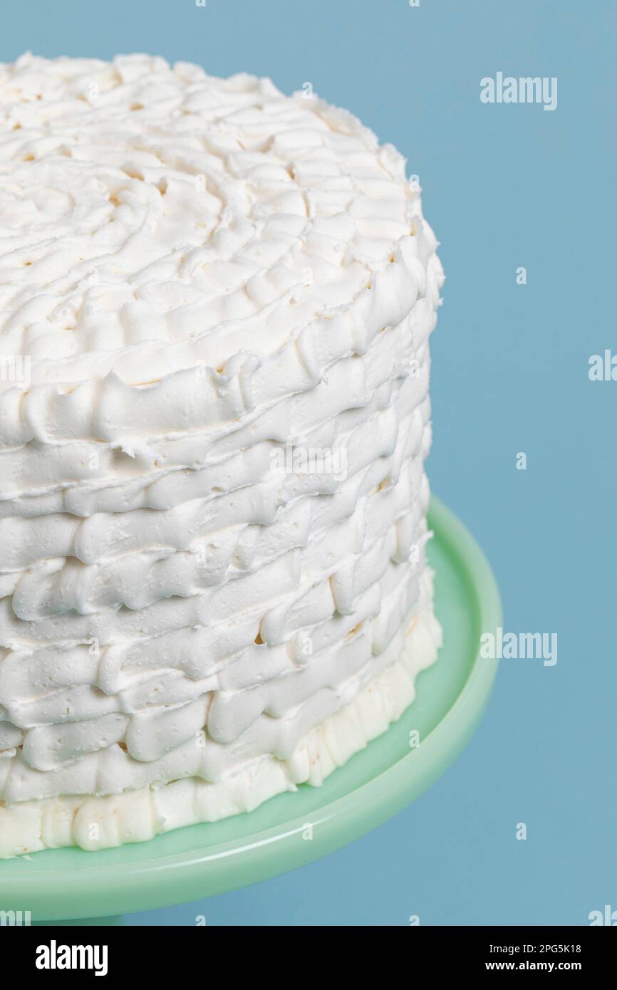Layer Cake ornately decorated with White Frosting Stock Photo