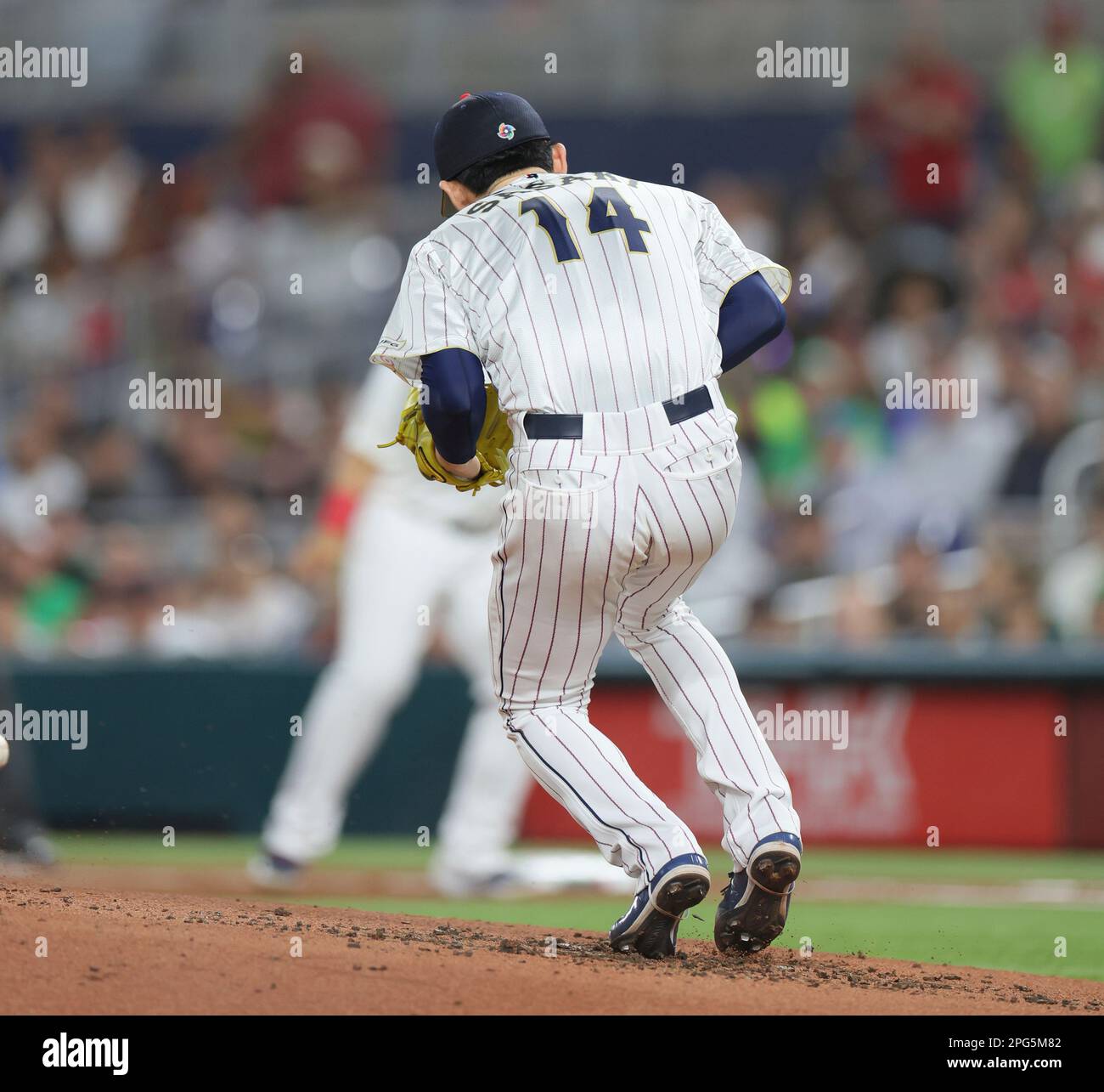 Roki Sasaki of Japan is hit by batted ball in the second inning during