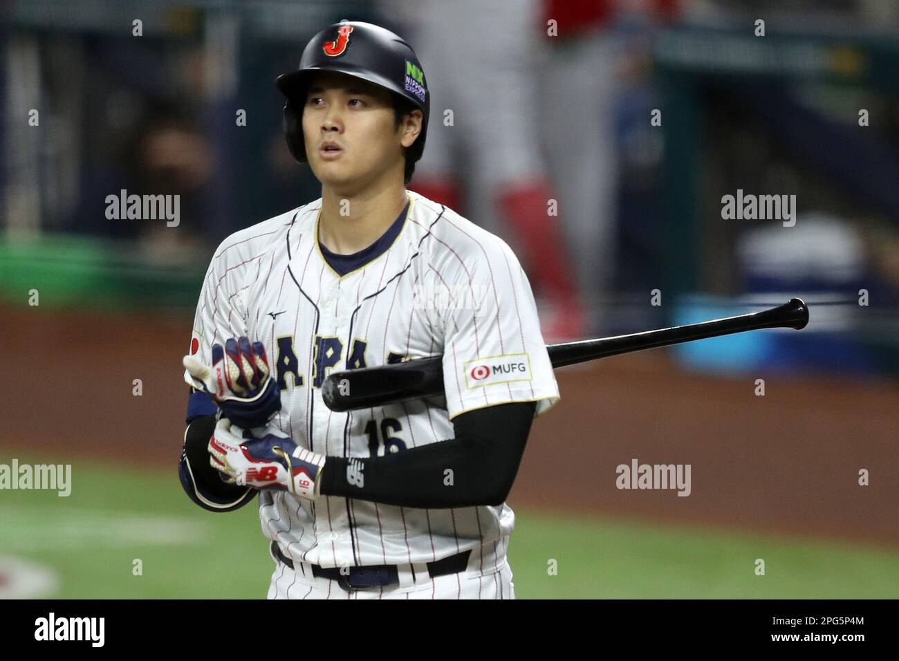 Miami, United States. 20th Mar, 2023. Japan's Shohei Ohtani (16) removes his glove after striking out in the first inning of the 2023 World Baseball Classic semifinal game against Mexico in Miami, Florida on Monday, March 20, 2023. Photo by Aaron Josefczyk/UPI Credit: UPI/Alamy Live News Stock Photo