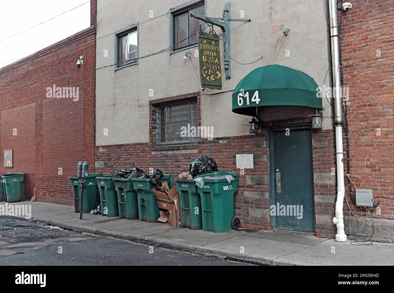 Johnny's Little Bar and Grille on Frankfort Avenue in downtown Cleveland has been a low-key bar for years even while the neighborhood gentrifies. Stock Photo