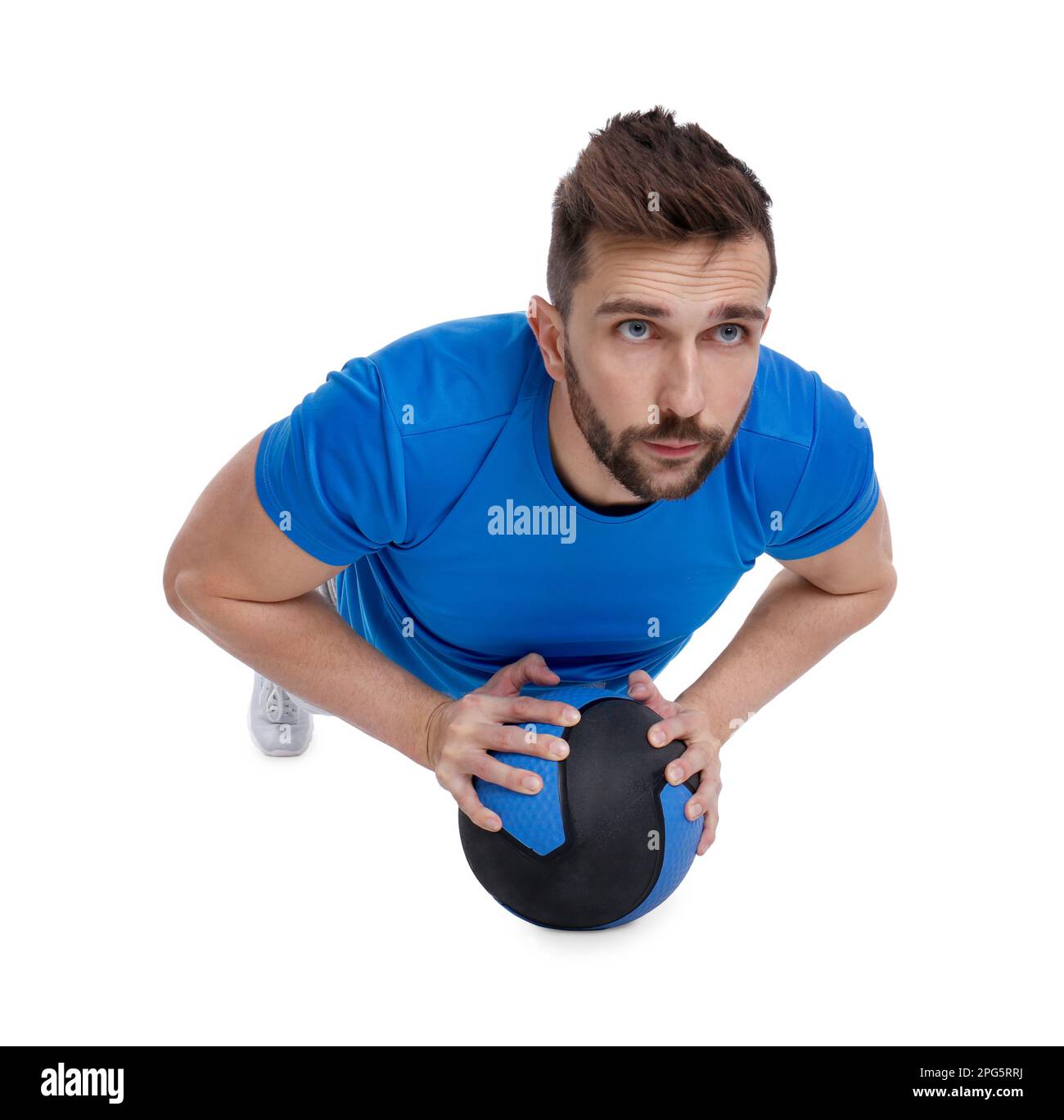 Athletic man doing exercise with medicine ball isolated on white Stock