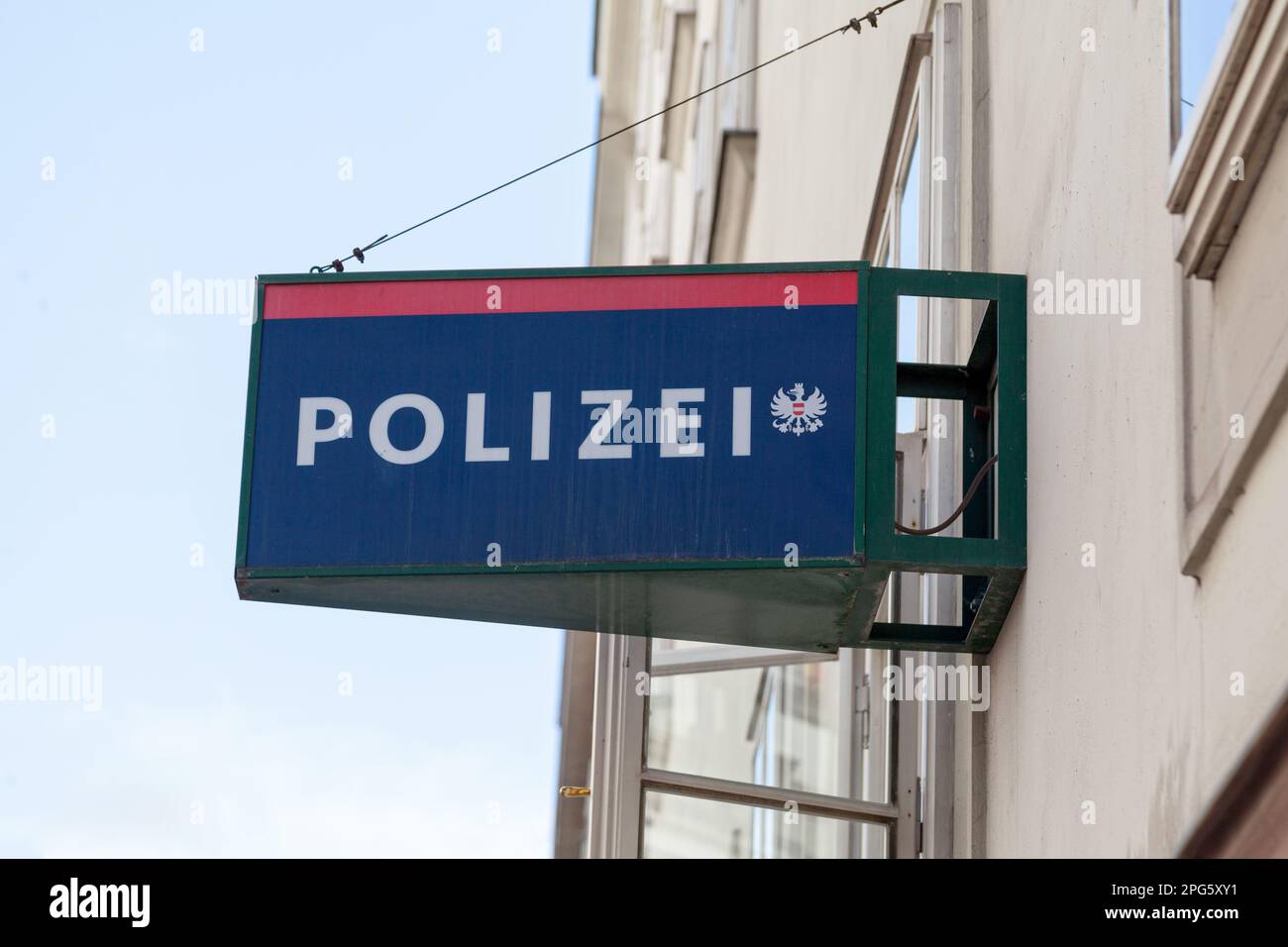 Vienna, Austria - June 18 2018: Police sign atop the entrance of a police station in Vienna with written 'Polizei' next to the Austrian coat of arms. Stock Photo