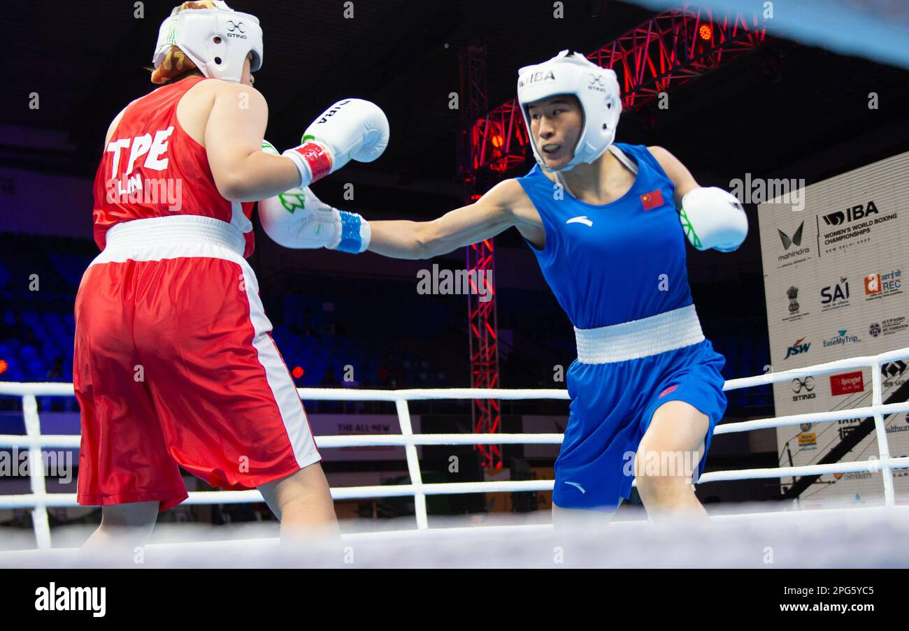 New Delhi, India. 20th Mar, 2023. Li Qian (R) competes with Lin Chien ...