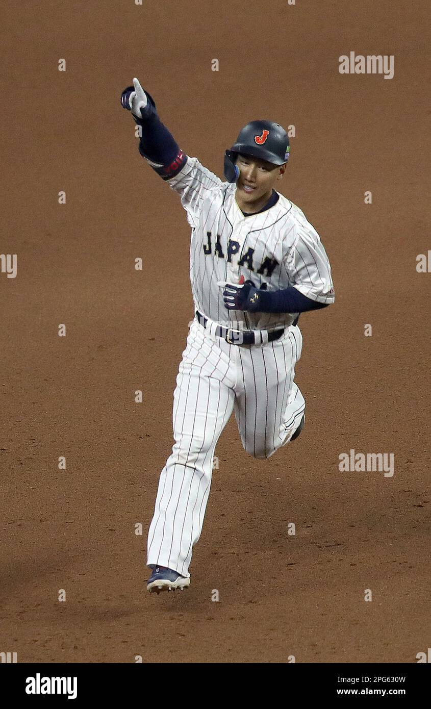 Miami, United States. 20th Mar, 2023. Japan's Masataka Yoshinda (34) celebrates as he rounds the base after hitting a three run home run in the seventh inning of the 2023 World Baseball Classic semifinal game against Mexico in Miami, Florida on Monday, March 20, 2023. Photo by Aaron Josefczyk/UPI Credit: UPI/Alamy Live News Stock Photo