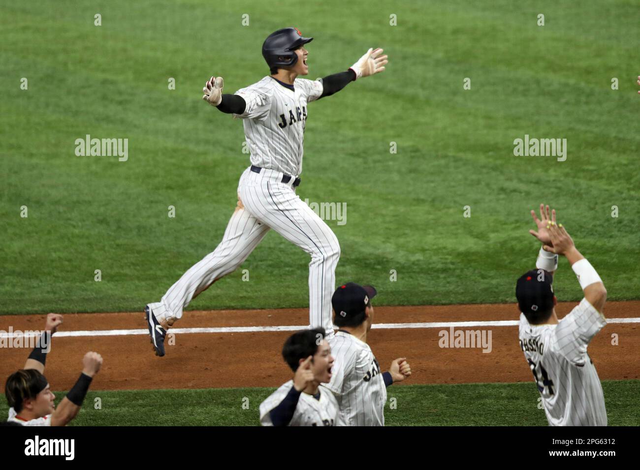 Miami, United States. 20th Mar, 2023. Japan's Shohei Ohtani (16) celebrates as he runs home off a home run by teammate Masataka Yoshinda (34) in the seventh inning of the 2023 World Baseball Classic semifinal game against Mexico in Miami, Florida on Monday, March 20, 2023. Photo by Aaron Josefczyk/UPI Credit: UPI/Alamy Live News Stock Photo