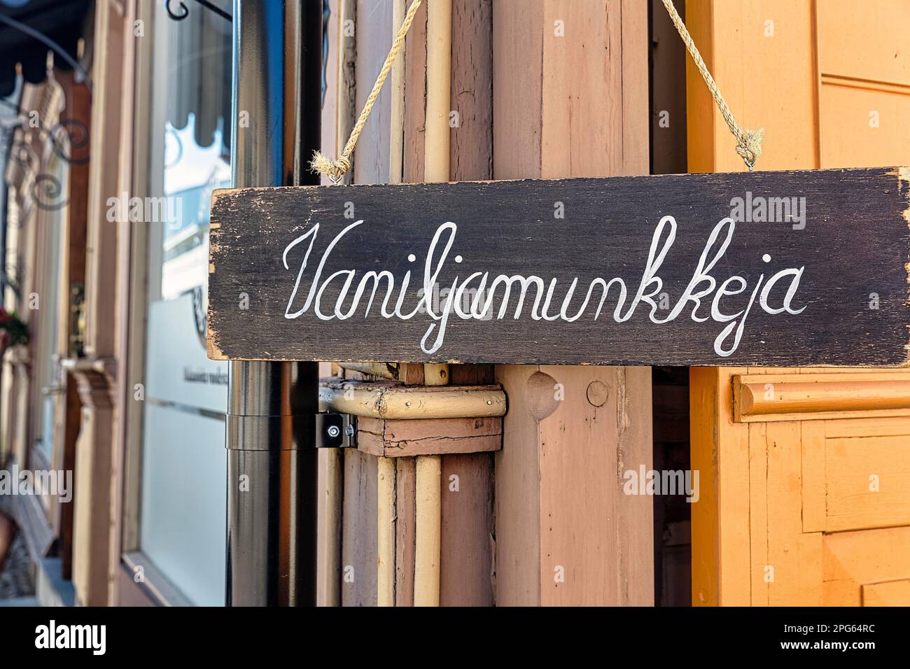 Wooden sign on facade, with inscription Vanilla Donuts, Finnish, Old Town of Rauma, UNESCO World Heritage Site, Satakunta, Finland Stock Photo