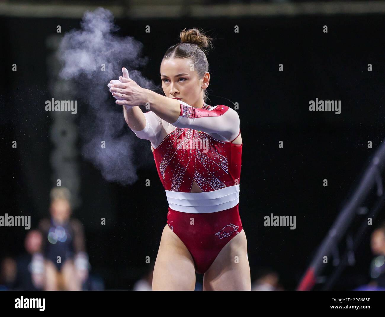 March 18, 2023 Norah Flatley claps her hands during her floor routine