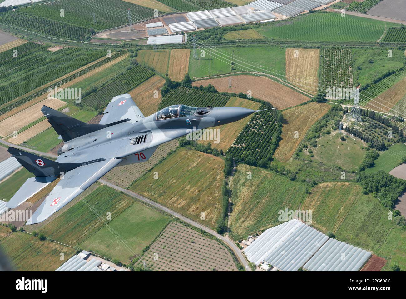 Polish Air Force Mig-29 Fighter Jet flying Above Turkey Countryside During Air-To-Air Flight Stock Photo