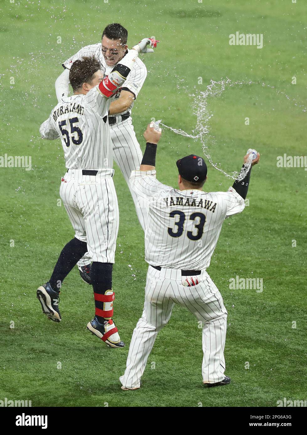 Miami, United States. 20th Mar, 2023. Japan's Munetaka Murakami (55) celebrates with Lars Nootbaar (23) and Hotaka Yamakawa (33) after hitting the game winning hit in the ninth inning of the 2023 World Baseball Classic semifinal game against Mexico in Miami, Florida on Monday, March 20, 2023. Photo by Aaron Josefczyk/UPI Credit: UPI/Alamy Live News Stock Photo