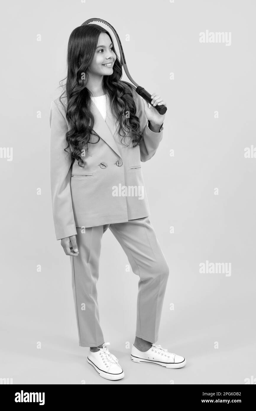 Female tennis player holding a tennis racket. Studio shot Stock Photo