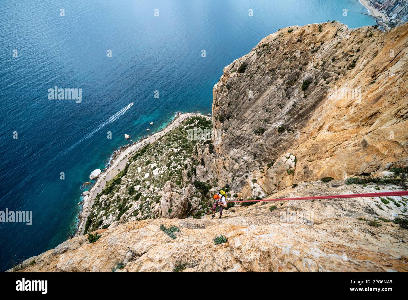 Trad rock climbing in Penyal d'Ifac National Park at Calp near Alicante