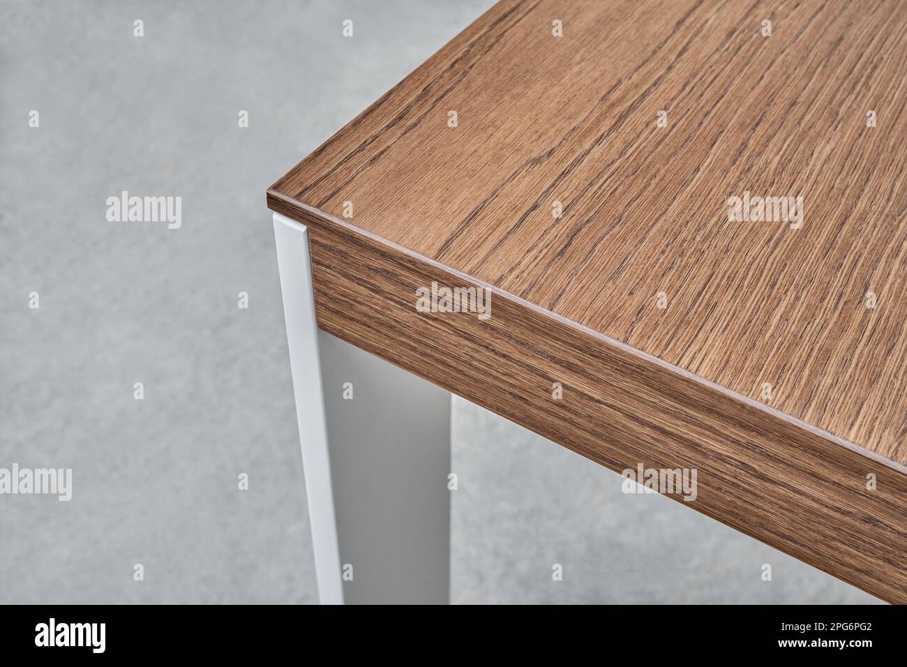 Minimalism style dining table with thin wooden table top of toned