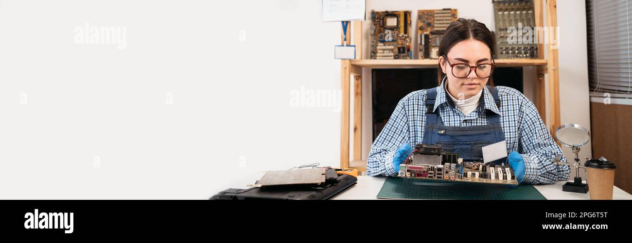 Engineer holding broken computer motherboard. Electronic renovation ...