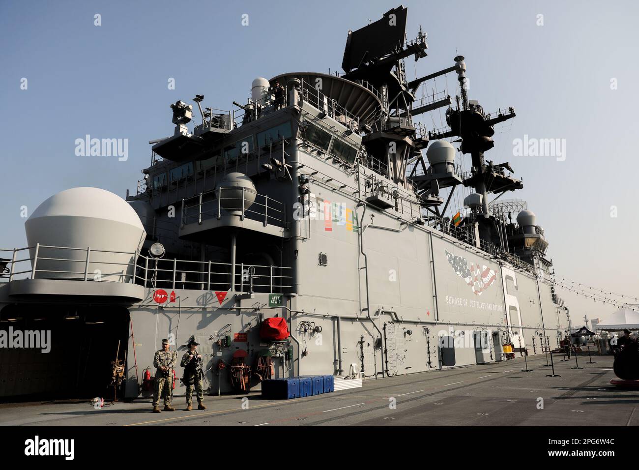 Manila, Philippines. 21st Mar, 2023. Armed US Navy sailors stand as they patrol the flight deck of the USS America (LH-6) amphibious assault ship during a port visit in Manila, Philippines. March 21, 2023. The American warship is currently on a routine mission operating with its allies and partners in preserving a free and open Indo-Pacific region. The USS America arrived in the country for a port call, ahead of next month's annual Balikatan or 'shoulder-to-shoulder'' exercises involving U.S. and Philippine forces. (Credit Image: © Basilio Sepe/ZUMA Press Wire) EDITORIAL USAGE ONLY! Not f Stock Photo