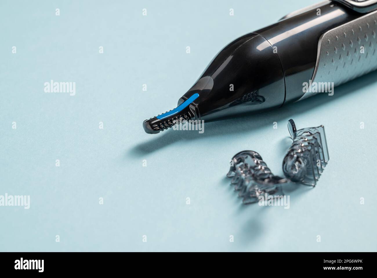 Top view of nose and ear hair trimmer isolated on blue background Stock Photo