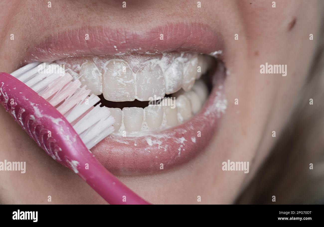 female in toothpaste closeup on blurry background Stock Photo Alamy