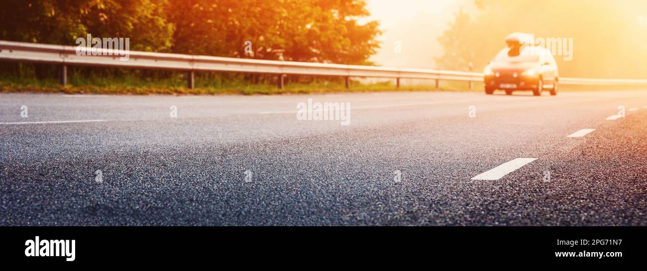 Car on the foggy road in the morning sunrise Stock Photo - Alamy