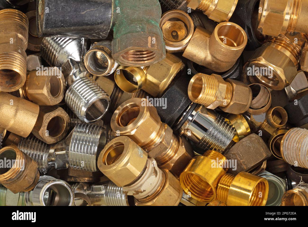 Brass and steel fittings for plumbing pipes, connector for two