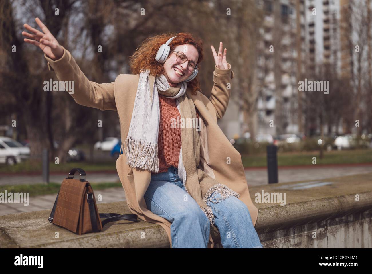 Natural portrait of cheerful caucasian ginger woman with freckles and