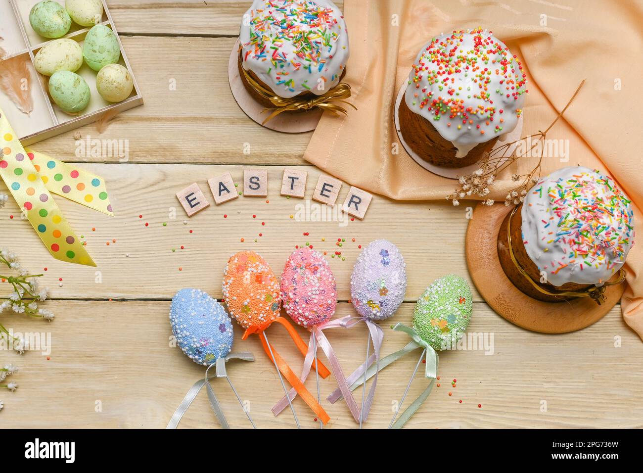 Beautiful Easter concept layout. Easter cakes with eggs. on a wooden table. Stock Photo