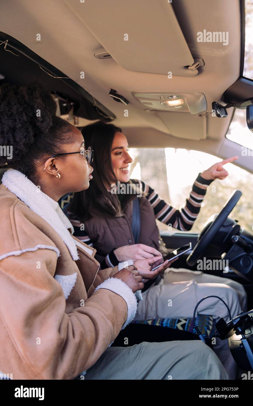 Women planning route map hi-res stock photography and images - Alamy