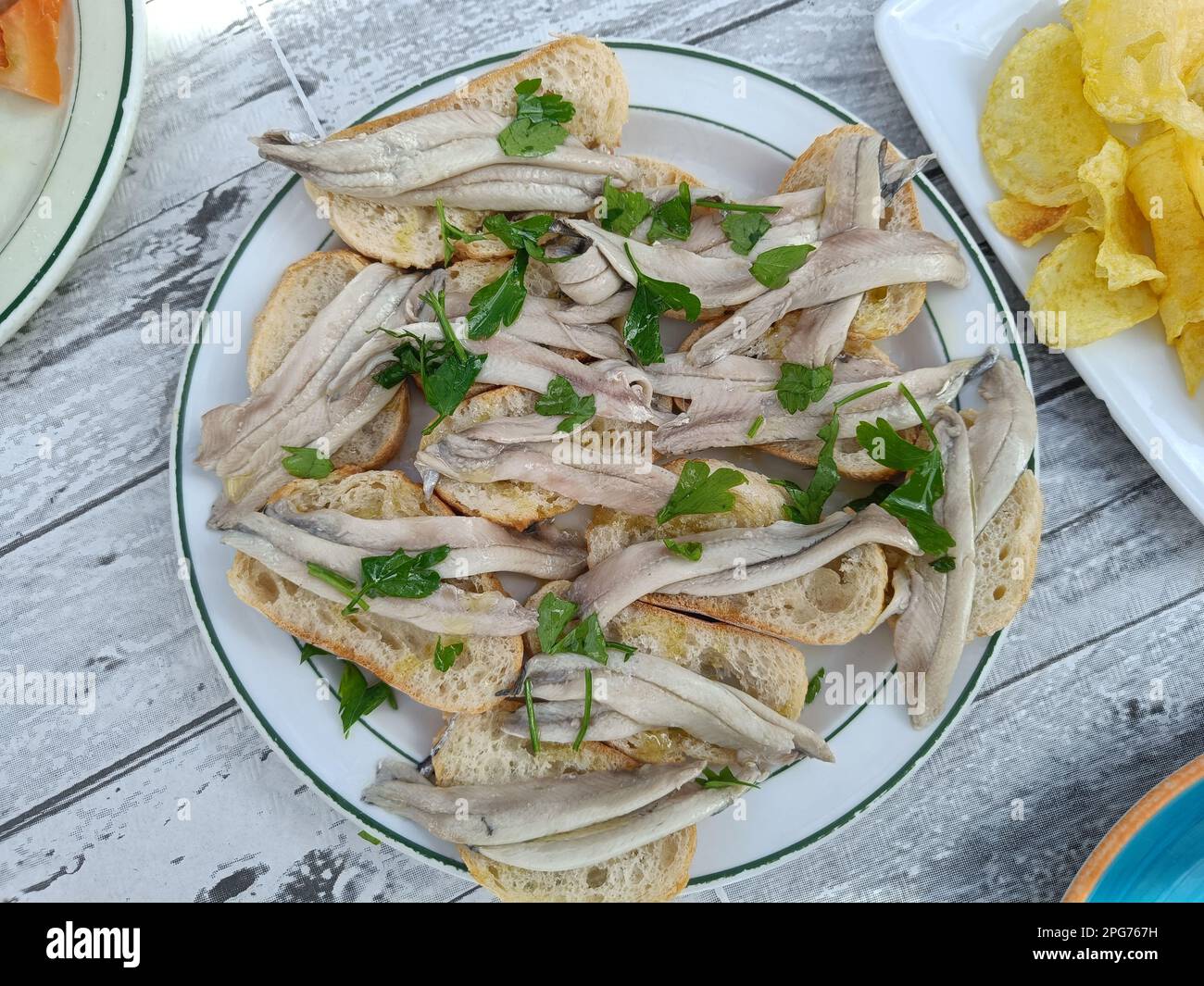 Mediterranean cuisine. Typical Andalusian dish, fresh raw anchovies in