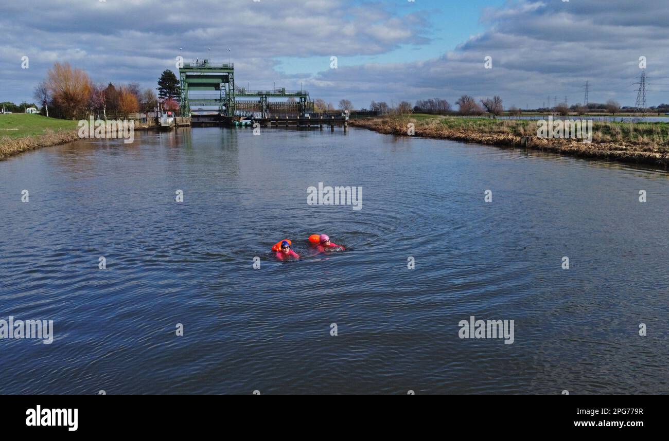Peterborough, UK. 19th Mar, 2023. Open water swimmers Karen Goodacre and Heather Yeoman enjoy a refreshing swim in the River Nene on the North Bank near Peterborough, Cambridgeshire, on 19th March, 2023. Credit: Paul Marriott/Alamy Live News Stock Photo