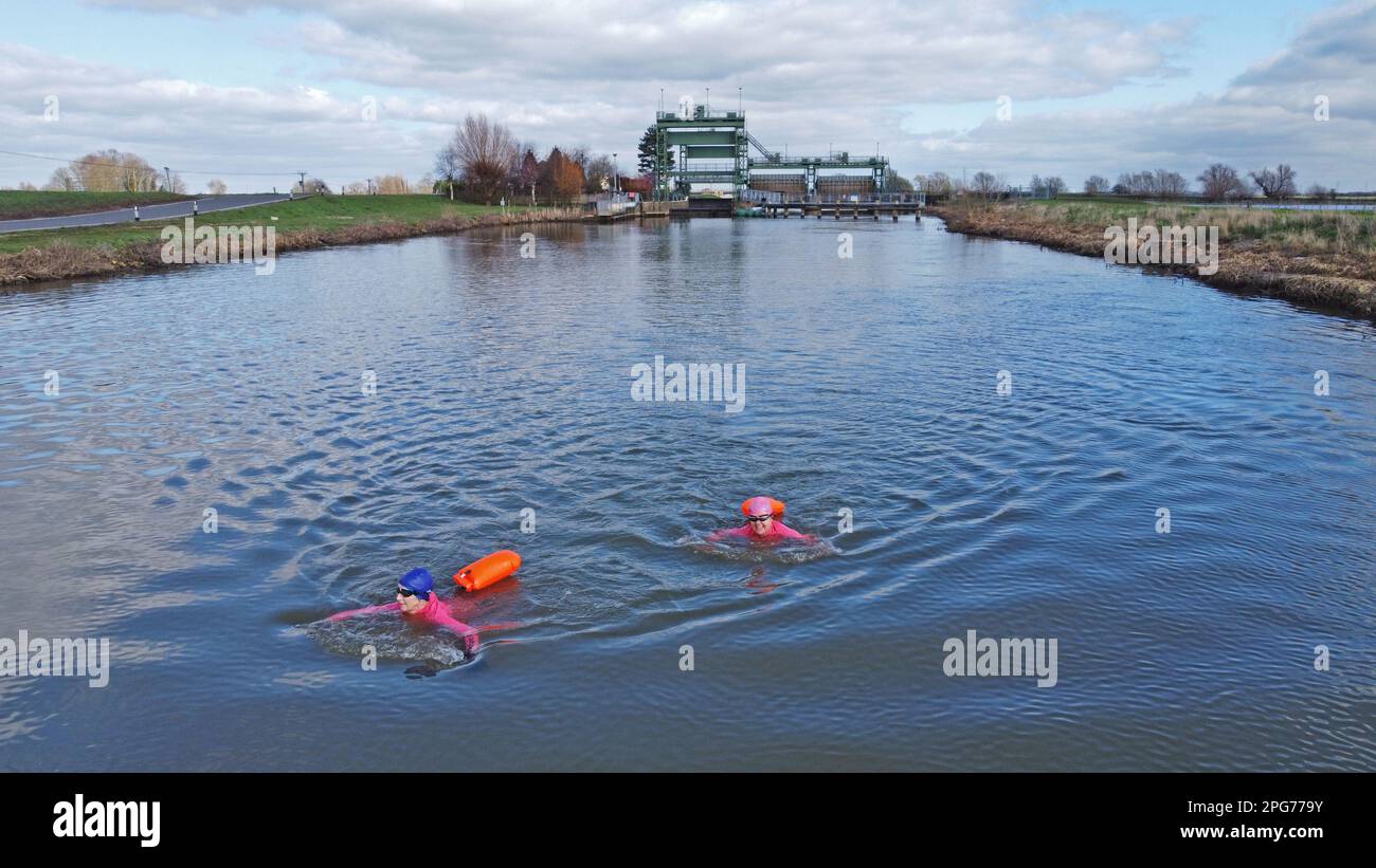 Peterborough, UK. 19th Mar, 2023. Open water swimmers Karen Goodacre and Heather Yeoman enjoy a refreshing swim in the River Nene on the North Bank near Peterborough, Cambridgeshire, on 19th March, 2023. Credit: Paul Marriott/Alamy Live News Stock Photo