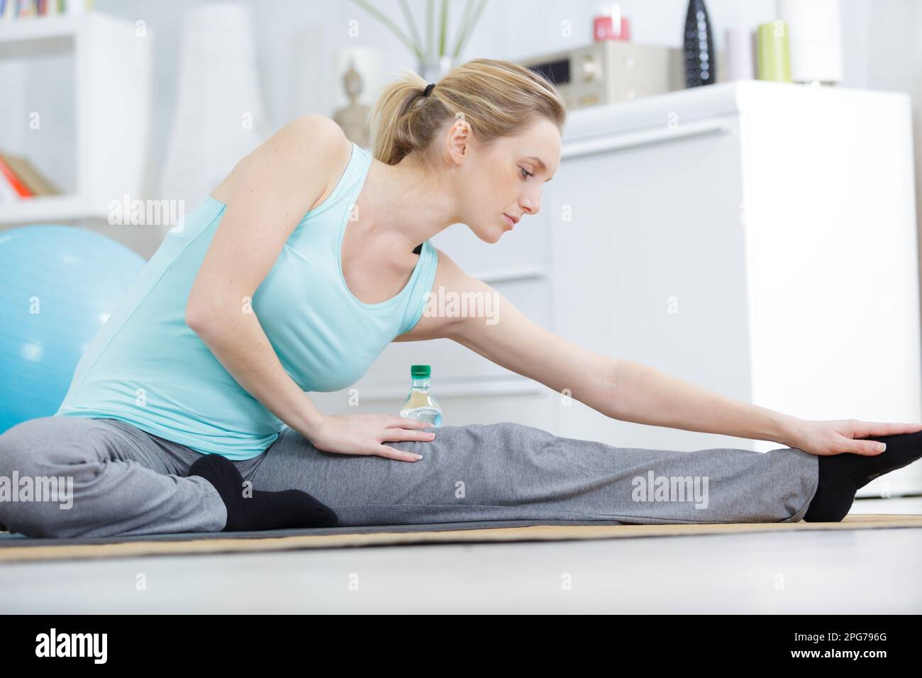 Joyful mature woman stretching hi-res stock photography and images - Alamy