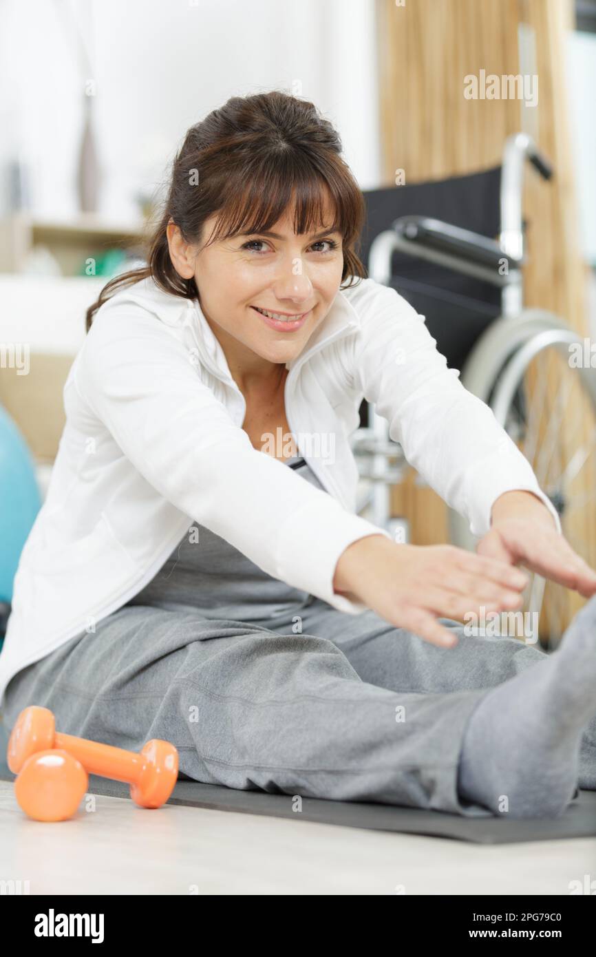 woman with paralyzed legs doing rehabilitation Stock Photo Alamy