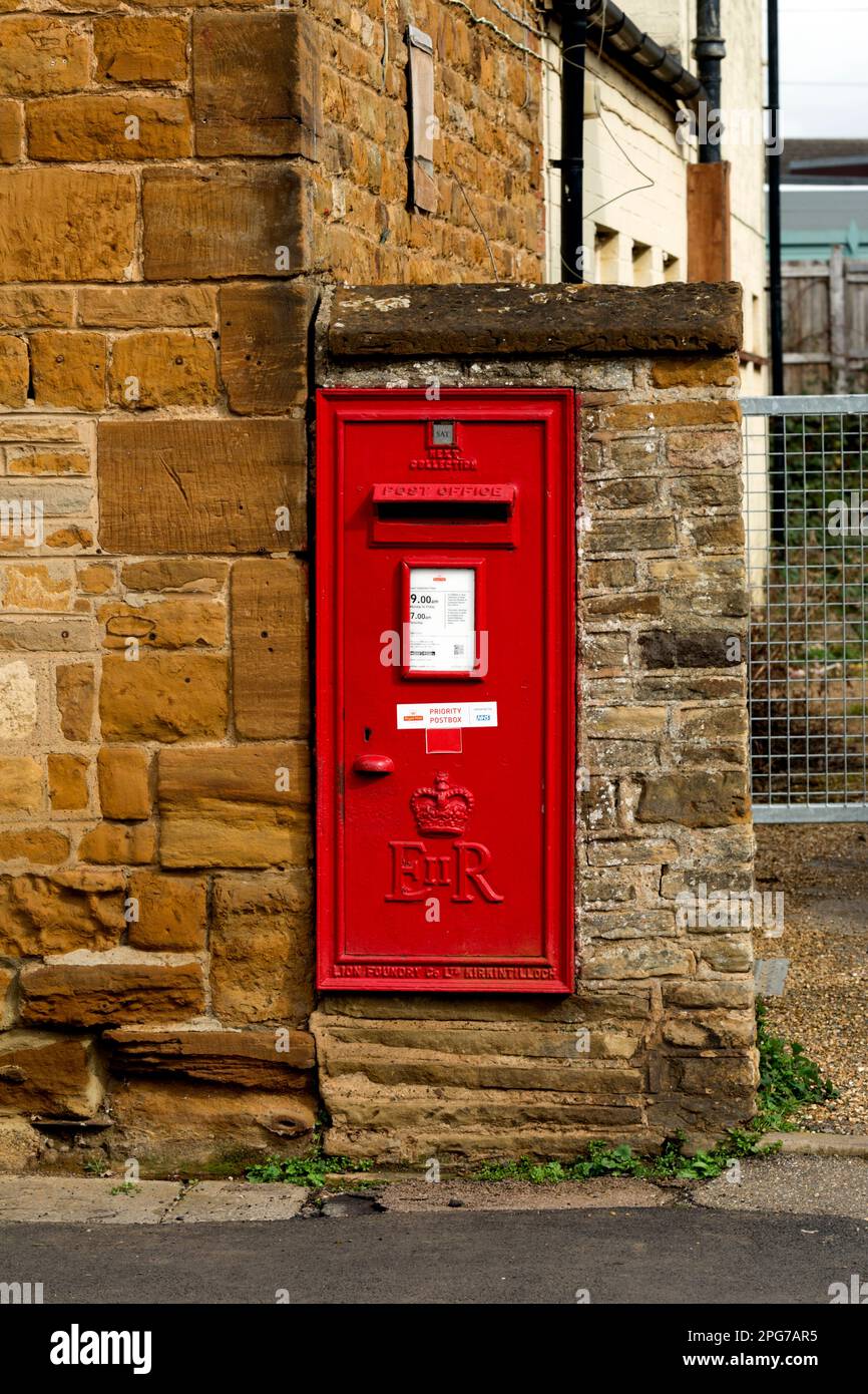 Wall mounted post box, Main Road, Duston, Northamptonshire, England, UK